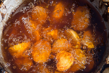 Fried young potatoes in oil
