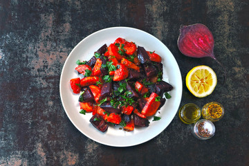 Salad of baked beets, pumpkins and carrots. Warm salad of winter vegetables. Healthy vegan salad with baked vegetables. Beet salad with pumpkin and carrot.
