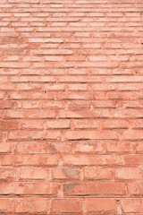 Obraz premium Brick wall with terracotta paint. For design, banner and layout