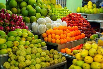 Fresh fruits for sale at night market in Vietnam. Exotic tropical food