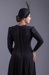 Glamorous 1930s woman in black dress