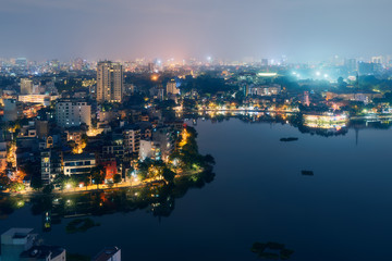 Hanoi Vietnam aerial cityscape view at night. City urban skyline of old town district
