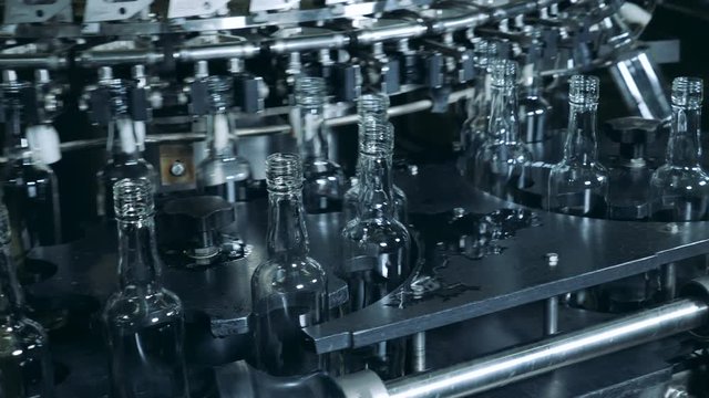 Washed bottles moving on a factory line, modern technology.