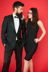 Official event concept. Man bearded wear tuxedo girl elegant dress. Formal dress code. Visiting event or ceremony. Couple classy clothes. Elite event. Main rules picking clothes. Corporate party