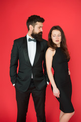 Man bearded wear tuxedo girl elegant dress. Visiting event or ceremony. Couple classy clothes. Elite event. Main rules picking clothes. Corporate party. All black dress code. Official event concept