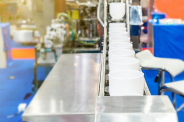 Close up modern buckets chain or bowl commercial conveyor (cup feeder) for food or material transport industrial