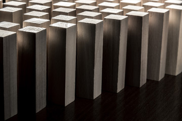 Risk and strategy in business, many identical wooden blocks