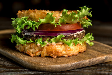 Healthy lifestyle, proper nutrition. Healthy rice burger with vegetables, herbs and cutlet
