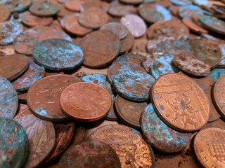 A pile of tarnished and partially corroded British copper coins - one and two pence pieces - and a lot of verdigris © Eddie