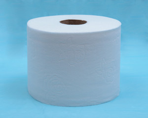 Soft strong and absorbent white toilet paper isolated on blue under pad.