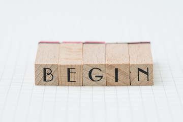 Begin, debut, company establish or start own business concept, wooden stamp with alphabet building...