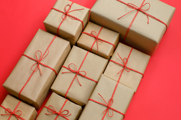 Fototapeta premium Handcrafted gifts with red twine bakground, Natural deisgn.