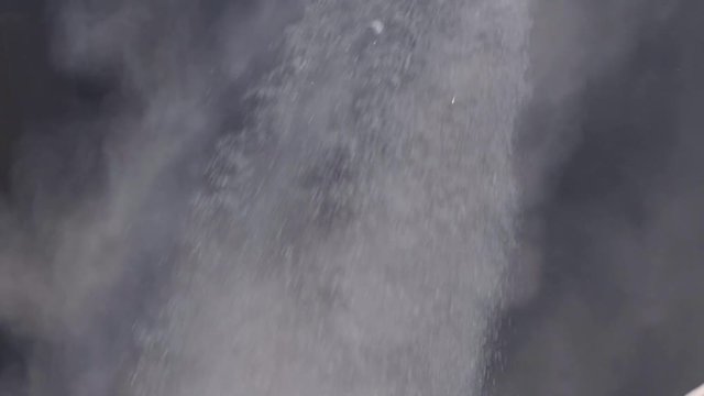 Coal dumping into ship barge pit slow-motion