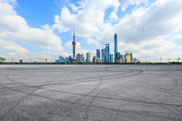 Fototapeta na wymiar Empty asphalt square ground and Shanghai business district cityscape