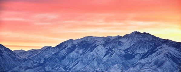 Sunrise of Winter panoramic, view of Snow capped Wasatch Front Rocky Mountains, Great Salt Lake...
