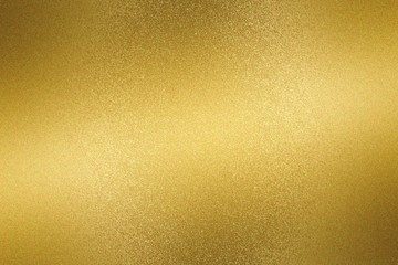 Glowing gold metallic plate surface, abstract background
