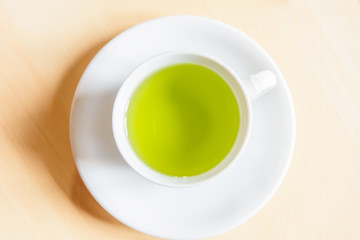 hot green tea on table