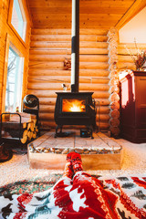 Cozy morning near the wood stove in cabin