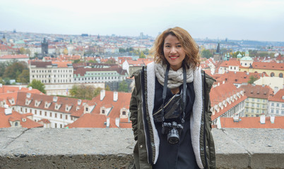 Asian woman sitting on observatory