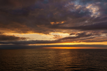Fototapeta na wymiar orange sunset in Strait of Georgia near Vancouver Island British Columbia Canada.