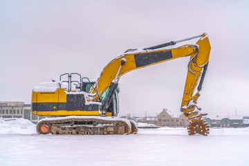 Construction vehicle on a winter landscape in Utah