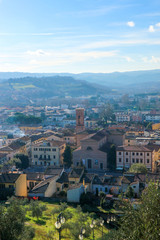 Fototapeta premium aerial view of the tuscany city Certaldo in morning winter fog with hills on the background, Italy