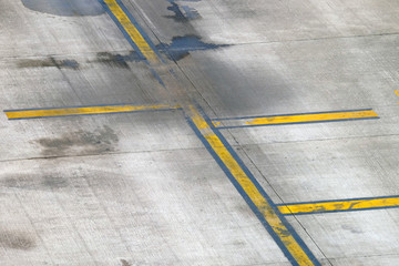 Yellow line painting on taxiway to guide pilot of airplane to drive at the airport