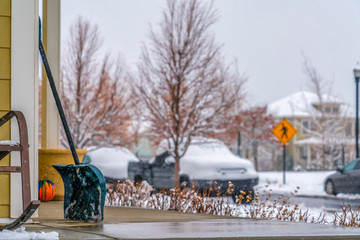 Snow shovel with snowy street in the background