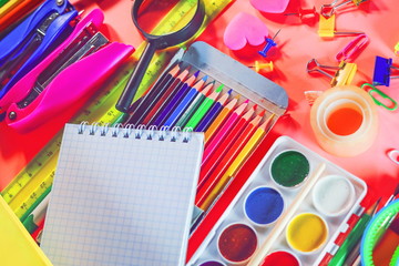 stationery accessories - pens, markers, paints, scissors, stickers, notepads.