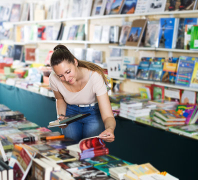 Woman buying textbooks