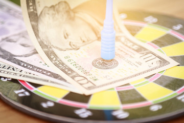 Dart sticking on dollar money for business target concept 