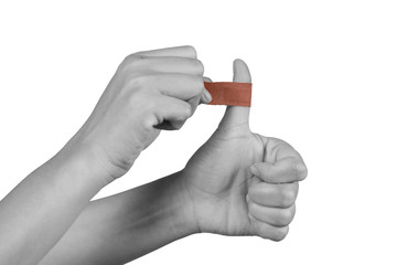 Hand women with adhesive plaster that covering a slight injury - isolated on white background with clipping path.