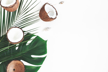 Summer composition. Tropical palm leaves, coconut on white background. Summer concept. Flat lay,...