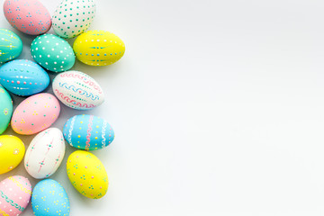 Decorated Easter eggs on white background border copy space