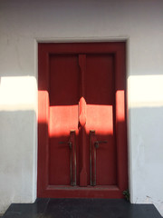 Antique red door in thai temple