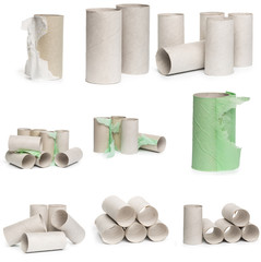 A selection of cardboard toilet paper tubes in various arrangements isolated on a white background