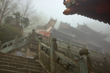 Ancient China kungfu Temple in foggy morning