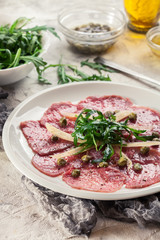 Beef carpaccio with arugula and parmesan
