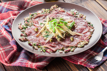 Beef carpaccio with arugula and parmesan