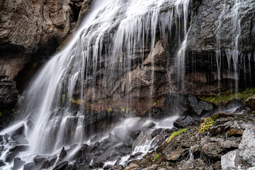 A beautiful landscape with mountain waterfall in Terskol. Elbrus area, Kabardino-Balkaria, Russian Federation