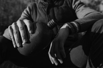 The flask in the man hands. Black and white