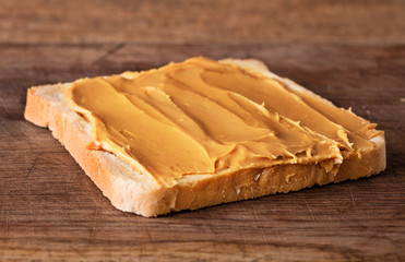 peanut butter sandwich on wooden background