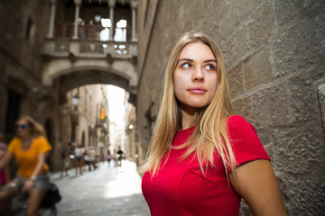 Fototapeta premium beautiful girl walks through the old European streets