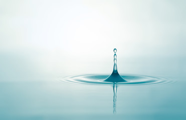 Water droplets on surface water background