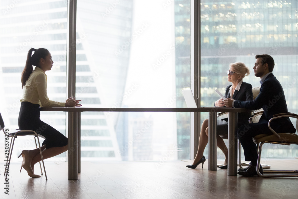 Sticker asian applicant introducing talking to hr managers at job interview