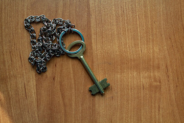 old key on a wooden surface