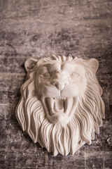 Creation of sculpture from plaster. Lion's head. Plaster workshop. Tooling.