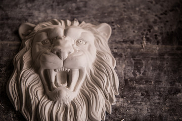 Creation of sculpture from plaster. Lion's head. Plaster workshop. Tooling.