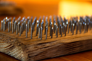 Board with nails for practicing yoga selective focus macro close-up. Copthorne impact on...