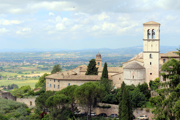 Assisi, Umbria, Italy. View of the central of italy countryside and the Church of Santa Maria Maggiore.